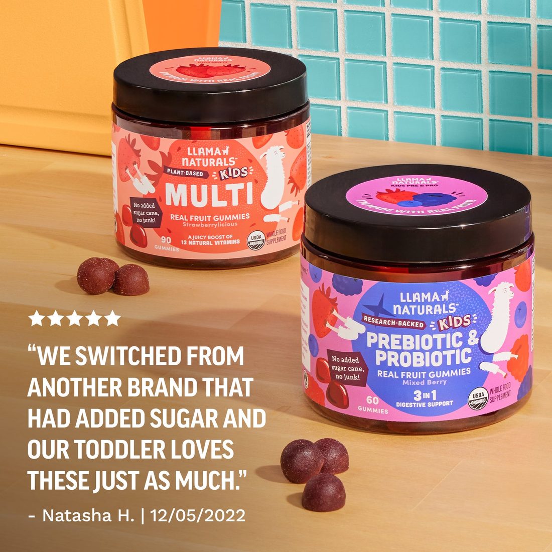 Two Llama Naturals Kids Multi jars on a kitchen counter beside a five-star parent review